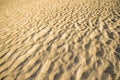 Sand of a beach with wave patterns Royalty Free Stock Photo