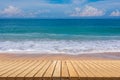 Sand beach with wood floor, blue sea and sky Royalty Free Stock Photo