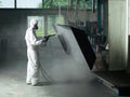 Sand blasting a metal Royalty Free Stock Photo