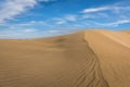 Sand in the Dunes of Maspalomas, a small desert on Gran Canaria, Spain. Sand blowing in the wind on top of the hill. Royalty Free Stock Photo