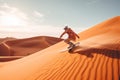 Sand boarding, desert safari. Sandboard. Sandboarding, Guy in dunes with energy, freedom and adrenaline. Orange sand and blue sky Royalty Free Stock Photo