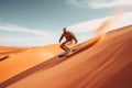 Sand boarding, desert safari. Sandboard. Sandboarding, Guy in dunes with energy, freedom and adrenaline. Orange sand and blue sky Royalty Free Stock Photo