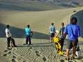 Sand boarding down dunes