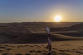 Sand boarding ,Dune Buggy parked in the desert during sunset at Huacachina Oasis in Ica, Peru