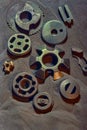 Sand casting, also known as sand moulded casting products are set on sand Royalty Free Stock Photo
