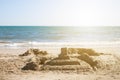 Sand castle on beach. Summer and holiday time. Relax. Sun is shining above the sea level. Royalty Free Stock Photo