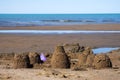 Sand castle on beach in summer time. Summer vacation concept. Summer sand beach background. Royalty Free Stock Photo