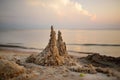 Sand castle built on the beach of Baltic sea on beautiful summer evening Royalty Free Stock Photo