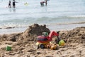 Sand castle and children`s toys - beach holiday