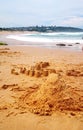 Sand castle, toy tools, seagull on beach Royalty Free Stock Photo