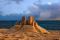 Sand castle on a tropical beach near the ocean Royalty Free Stock Photo