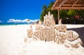 Sand castle on white tropical sandy beach Royalty Free Stock Photo