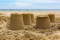 Sand castles on the beach, blue sea Summer holidays concept Royalty Free Stock Photo