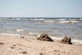 Sand castles on the beach with wavy sea Royalty Free Stock Photo