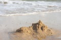 Sand castles destroyed by sea water But the remains of the ruined soil Summer concept Unsustainable and uncertain Royalty Free Stock Photo