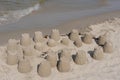 Sand castles and towers built on a beach at the sea in summer on a sunny day Royalty Free Stock Photo