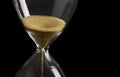 Sand clock , Hourglass as time passing on isolated black background , Life time concept Royalty Free Stock Photo