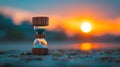 A sand clock with hourglass sitting on a beach at sunset, AI Royalty Free Stock Photo