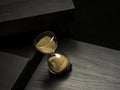 Sand clock over a black background Royalty Free Stock Photo