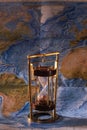 Sand clock time hour glass on map Royalty Free Stock Photo