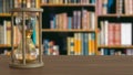 The Sand clock on wood table in library image 3d rendering Royalty Free Stock Photo