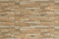 Sand color brown stone tile vintage wall abstract pattern texture background backdrop seamless Royalty Free Stock Photo
