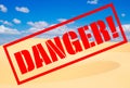 Sand desert with sign Danger!