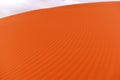 Sand dune, detail of blown orange sand, structure and patterns of the dune, Africa Royalty Free Stock Photo