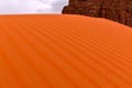 Sand dune, detail of blown orange sand, structure and patterns of the dune, Africa Royalty Free Stock Photo