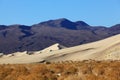Sand dune in Eureka and red rocks Royalty Free Stock Photo