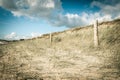 Sand dune and fence on a beach, Re Island, France Royalty Free Stock Photo