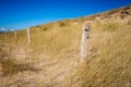 Sand dune and fence on a beach, Re Island, France Royalty Free Stock Photo