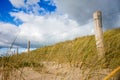 Sand dune and fence on a beach, Re Island, France Royalty Free Stock Photo