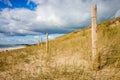 Sand dune and fence on a beach, Re Island, France Royalty Free Stock Photo