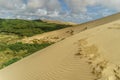 sand dune with footprints under cloudy sky, Giant Sand Dunes,