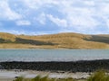 Sand dune patterns in landscape across bay in Opononi Royalty Free Stock Photo