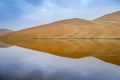 Badain Jaran Desert with lake and reflection Royalty Free Stock Photo