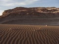 Sand dune and stonewall in Valle de la Luna, Atacama Desert, Chile. Royalty Free Stock Photo