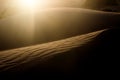 Sand dune on the sunset with sun flare Royalty Free Stock Photo