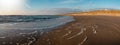 Sand dune with wild grass and beach in Noordwijk on the North Sea in Holland Netherlands - Panorama sea landscape with blue sky Royalty Free Stock Photo