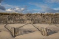 Sand dune windswept fences shadows Royalty Free Stock Photo