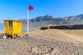 Sand dune and yellow lifeguard booth