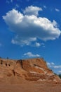 Sand dunes against the blue sky and white clouds. Royalty Free Stock Photo