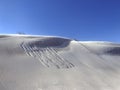 Sand dunes against deep blue sky Royalty Free Stock Photo