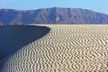 Sand dunes on the background of the mountains in Socotra island, Yemen Royalty Free Stock Photo