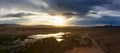 Sand dunes Bayan Gobi and lake at sunset