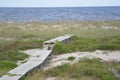 The harsh beach conditions take a severe toll on the wood planks of the boardwalk