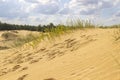 Sand dunes in the blue sky clouds, footmarks in the sand