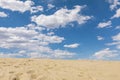 Sand dunes and blue sky with white clouds Royalty Free Stock Photo