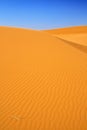 Sand dunes and cloudless blue sky Royalty Free Stock Photo